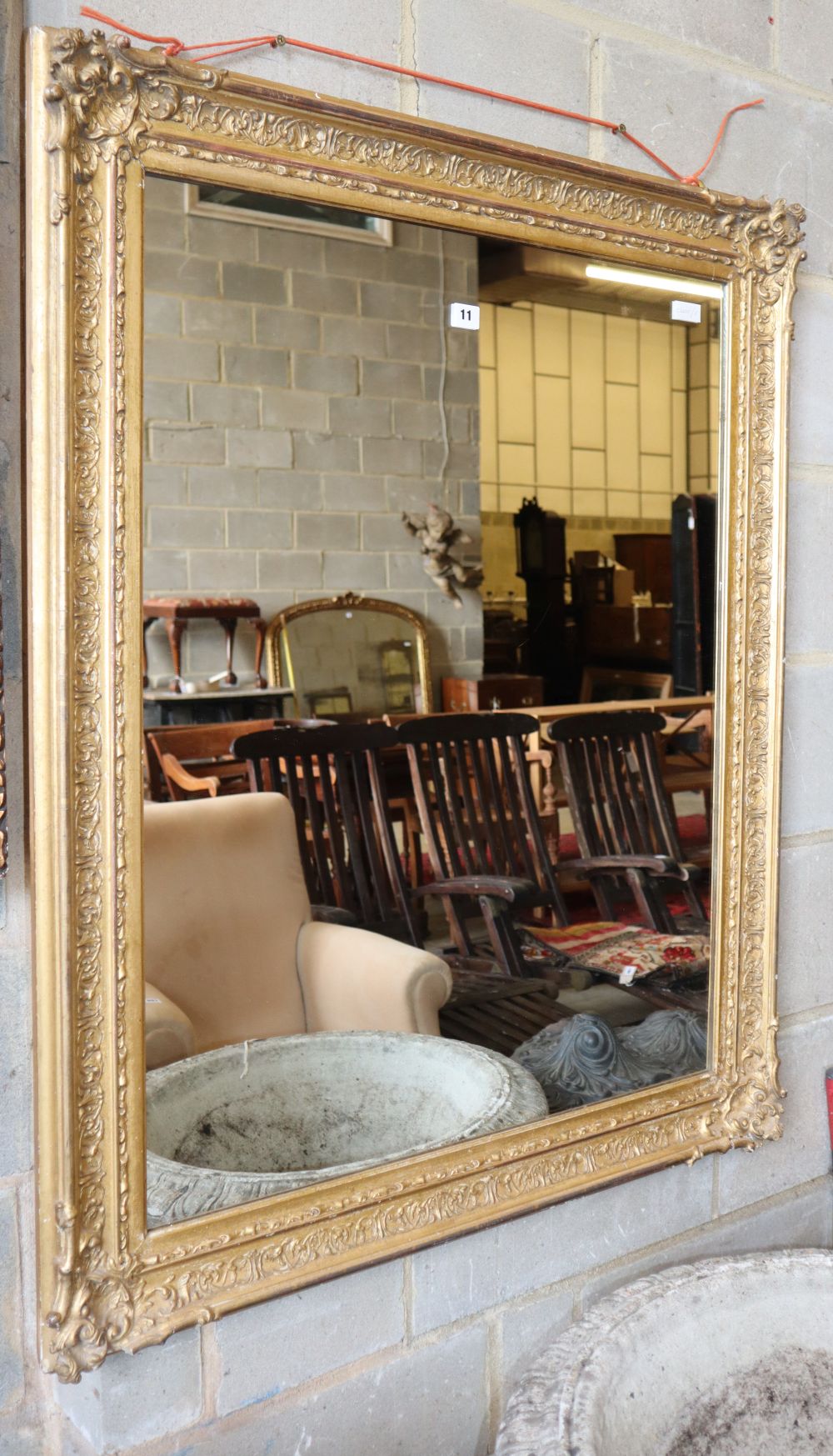 A Victorian rectangular giltwood and gesso wall mirror, 90cm x 110cm